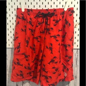 NWT men’s red swim trunks with navy lobsters.